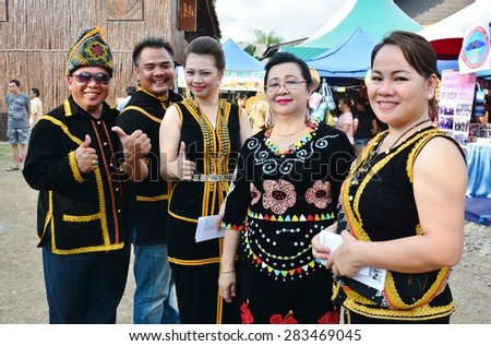 SABAH, MALAYSIA - MAY 31, 2015 : Kadazan Dusun Penampang people in traditional costume pose for the camera during Harvest Festival celebration May 31, 2015 in Kota Kinabalu, Sabah, Malaysia.