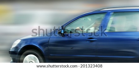 Car in motion (panning)