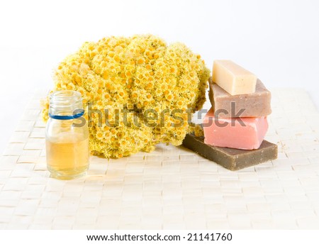Spa treatment with dried flowers, soap and aroma oil