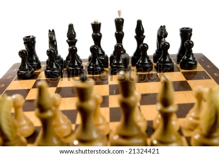 Black and white chessmen on chess field