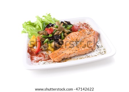 grilled salmon with vegetables on white plate