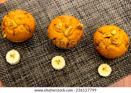 banana nut muffins with fresh bananas and walnuts