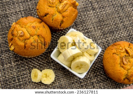 banana nut muffins with fresh bananas and walnuts