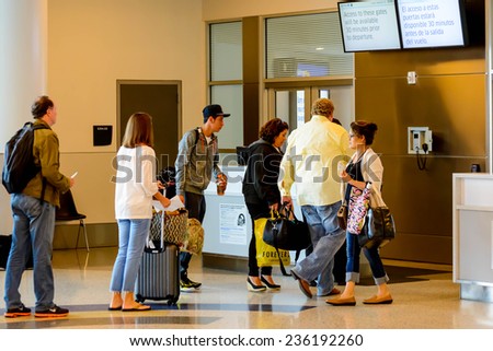 September 12, 2014: IAH, Houston Intercontinental Airport, Houston, TX, USA - Passengers queued in line for boarding at departure gate