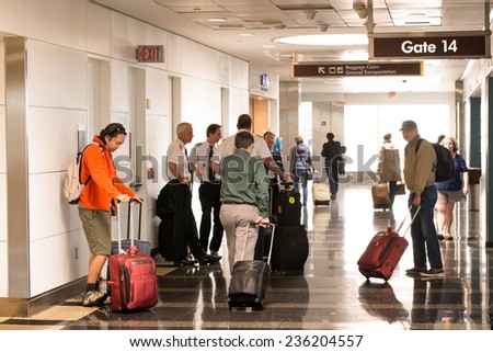 October 2, 2014: DCA, Reagan National Airport, Washington, DC - passengers waiting in the corridor for a flight