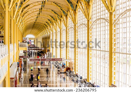 October 2, 2014: DCA, Reagan National Airport, Washington, DC - people on a moving walkway in a bright airport