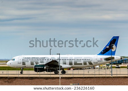 September 12, 2014: DIA, DEN, Denver International Airport - Frontier airplane on the tarmac
