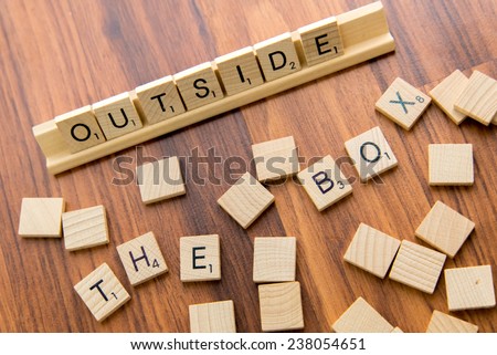December 14, 2014 - Houston, Texas, USA - illustrative editorial of Scrabble tiles spelling OUTSIDE THE BOX