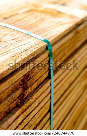 Building supplies, Stacked wood fence lumber