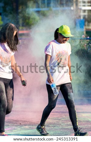 November 1, 2014 - Houston, TX, USA: Color Fun Fest 5K run. Runners completing the course with colored powder