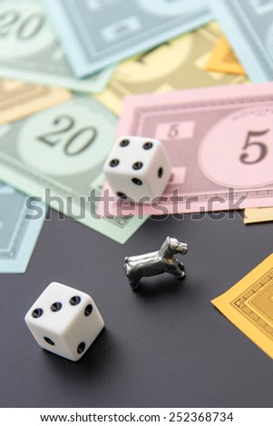February 8, 2015 - Houston, TX, USA.  Monopoly dog, dice and money