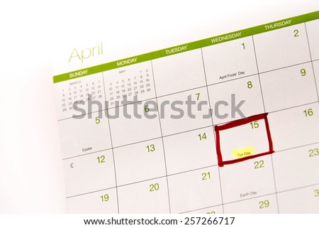 Calendar with a red box around Tax Day, April 15th