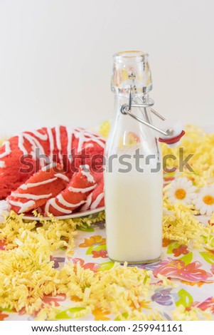 pink cherry pudding cake and a jug of milk
