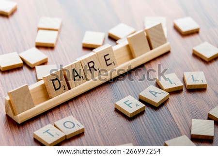 April 4, 2015:  Houston, TX, USA (Illustrative Editorial) - Scrabble Word Game wood tiles spelling DARE TO FAIL