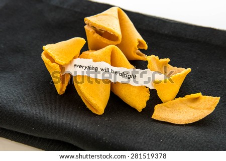 open fortune cookie with strip of white paper - EVERYTHING WILL BE ALRIGHT
