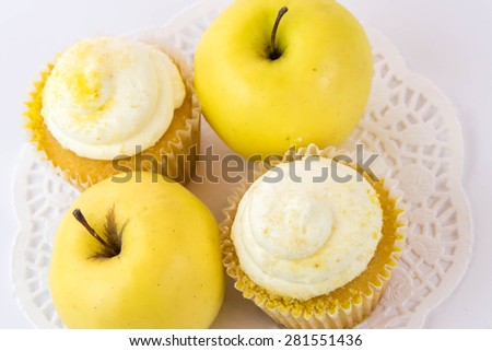 yellow apple vs yellow cupcake - snack decision between healthy food or junk food