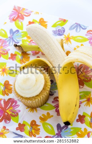 yellow banana vs yellow cupcake - snack decision between healthy food or junk food