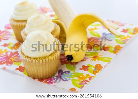 yellow banana vs yellow cupcake - snack decision between healthy food or junk food