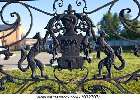 NEVYANSK, RUSSIA - JULY 3, 2014: Photo of Coat of arms on the fence around the Demidov Leaning Tower.