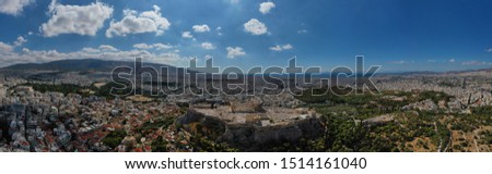 Aerial drone panoramic photo of iconic city of Athens and famous Acropolis hill featuring masterpiece of Ancient times the Parthenon, Attica, Greece