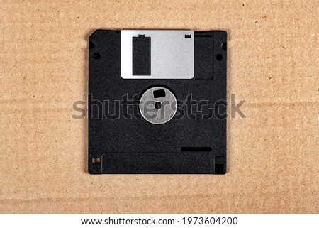 Floppy Disk Drive on the Cardboard Background closeup
