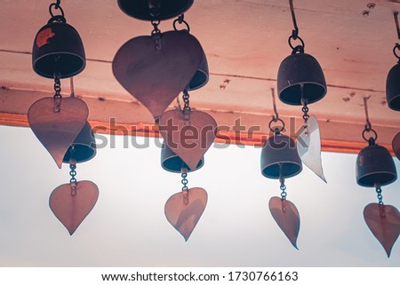 Hanging brass bells and bodhi leaves as a religious symbol for Buddhism