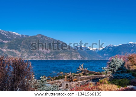 Burrard Inlet, ocean and island with mountains in beautiful British Columbia. Canada.