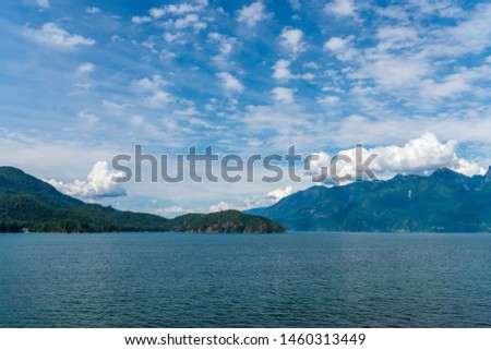 View over Inlet, ocean and island with mountains in beautiful British Columbia. Canada.