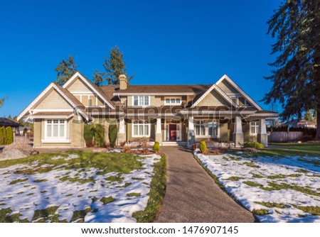 Houses in suburb at Winter in the north America. Luxury houses covered nice snow