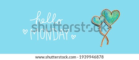Hello Monday message with hand draw blue hearts - flat lay
