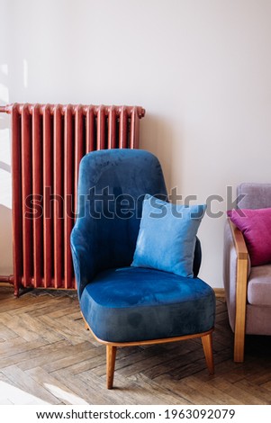 bright living room. blue velvet armchair. luxury room design