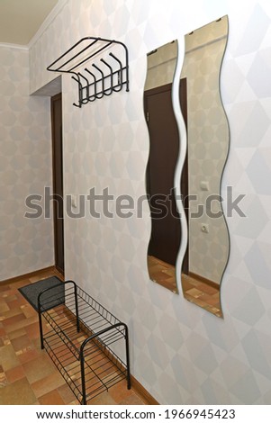 Corridor with two curly mirrors on the wall. Interior