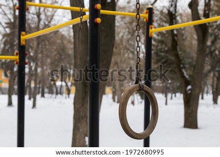 Injury playground or unsafe gymnastic equipment. Torn off ring. Copy space for text or inscriptions. Background