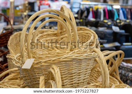 New wicker baskets on a store shelf. Decor goods.