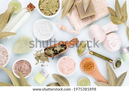 Spa and skin carehomemade cosmetics. Bottles with spa cosmetic products on pastel background.