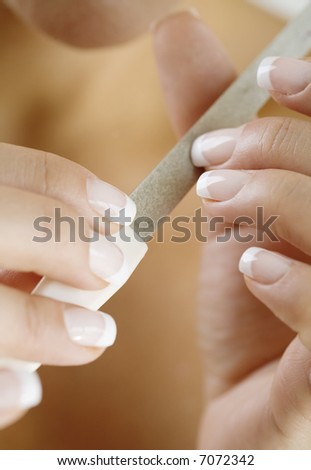 female filing nails