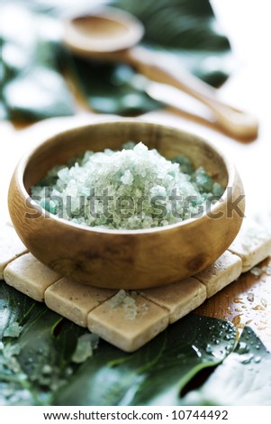 bowl of scented bath-salt, surrounded by banana leafs