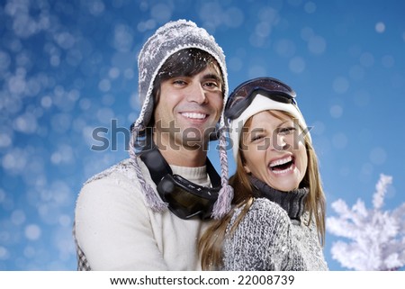 couple in their late 20s in ski hats and glasses