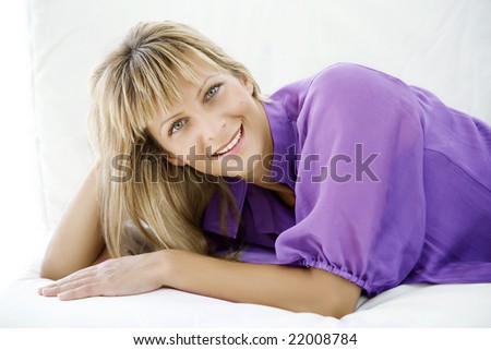 female in her late 20s lying on the couch