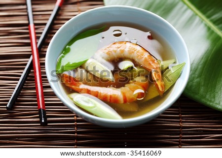 light asian shrimp soup with kafir leaves and spring onions