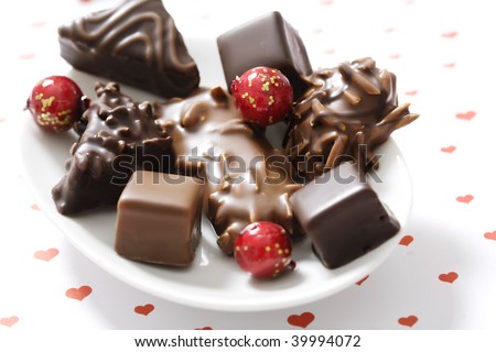 assortment of chocolate covered gingerbread with almonds and nuts