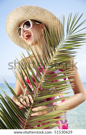young female in summer outfit in tropical destination, styling is a 1950s