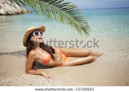 female in bikini enjoying the sun