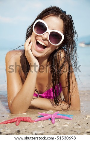 young attractive female sunbathing and having fun
