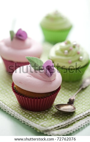 closeup of beautiful summer cupcake with strawberry flavoured cream