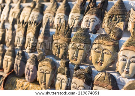Carved wooden faces of Myanmar kings and ancient people, Myanmar
