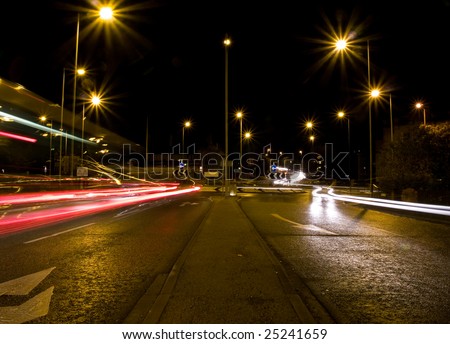 Light Streaks from Cars Travelling Clockwise Around a Roundabout.