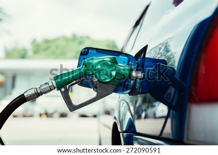 Petrol pump filling closeup