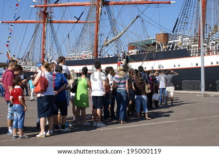 PORT CONSTANTA,ROMANIA - MAY 25, 2014. People who visits the sailboats who participate at the competition THE BLACK SEA TALL SHIPS REGATTA 2014.