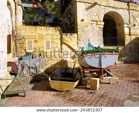 Isolated rustic corner with fishing boats in break